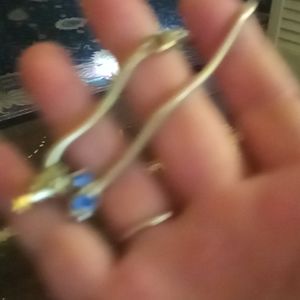 Sterling silver charm bracelet it has a blue Crystal round charm on it & tree.